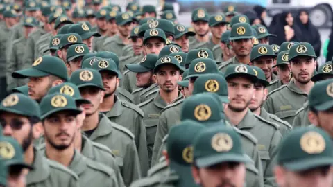 EPA Members of Iran's Islamic Revolution Guards Corps (IRGC) at a parade on 11 February 2019