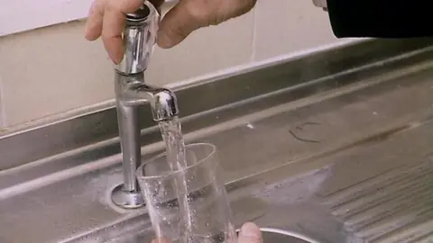 BBC Filling glass of water
